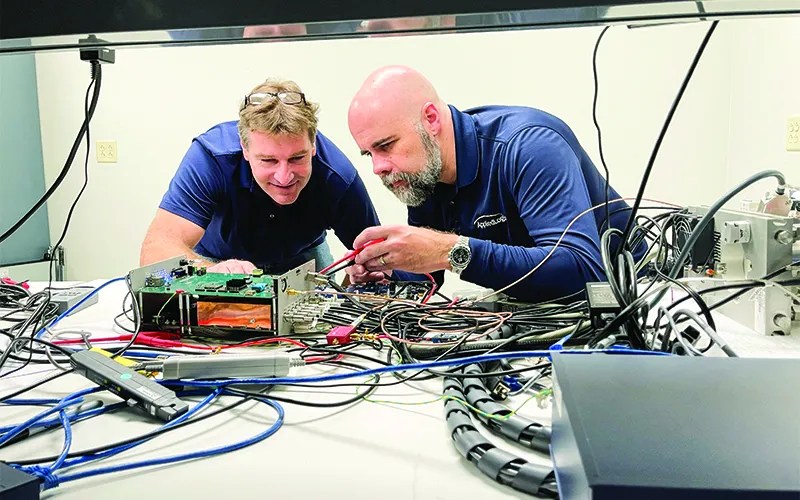 9-Pricing-TeamCollaboratingAroundElectronics
